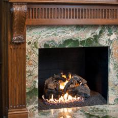 Oak Mantle and Fireplace Frame With Green and Neutral Stone Mantel