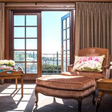 Balcony French Doors in Master Bedroom With Rose Velvet Armchair and Ottoman 