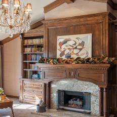 Traditional Wood Fireplace Featuring Built In Bookshelves and Stone Hearth 