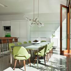 White Modern Eat-In Kitchen With Green Chairs