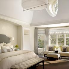 White Transitional Master Bedroom With Round Window