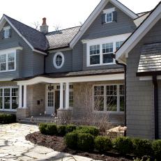 Gray Cape Cod Exterior and Stone Walkway