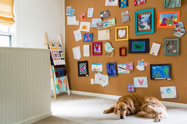 A roll of cork is lightweight and easy to cut and install. Go big and cover an entire wall for an intentional, tidy look. For extra punch and color, spray paint empty frames and mount with picture hanging strips to showcase those “special” pieces! 