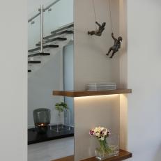 Contemporary Foyer With Shelves and Sculptures