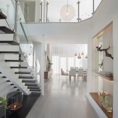 Contemporary Foyer With Floating Staircase