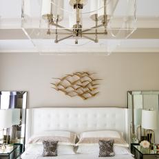 Art Deco Master Bedroom With White Headboard