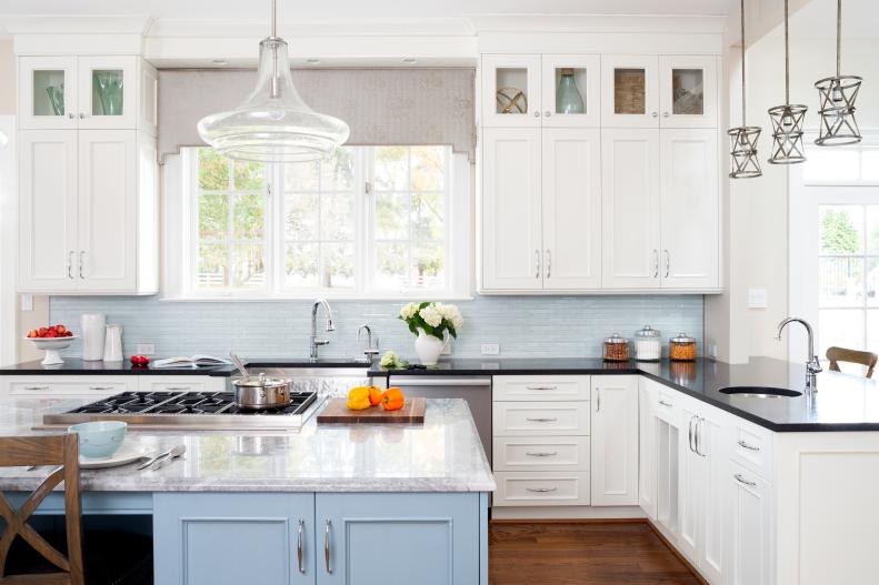 White Kitchen With Glass Pendants