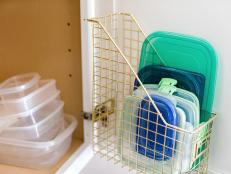 Organize plastic lids by mounting an old magazine file to the inside of the cabinet so you easily find the correct size lid when you’re in a hurry. If you have a gazillion lids, hang a file designated specifically for each size lid.