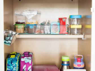 Streamline the process by creating this super simple lunch prep station. Keep lunch boxes, water bottles, and utensils, along with pre-packaged snacks all in one area for fast packing.
