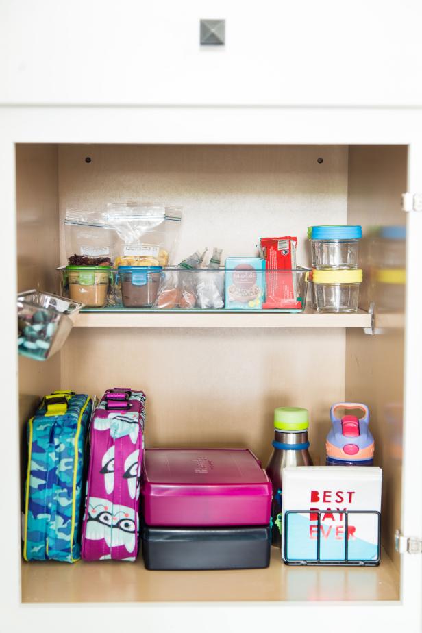 Streamline the process by creating this super simple lunch prep station. Keep lunch boxes, water bottles, and utensils, along with pre-packaged snacks all in one area for fast packing.