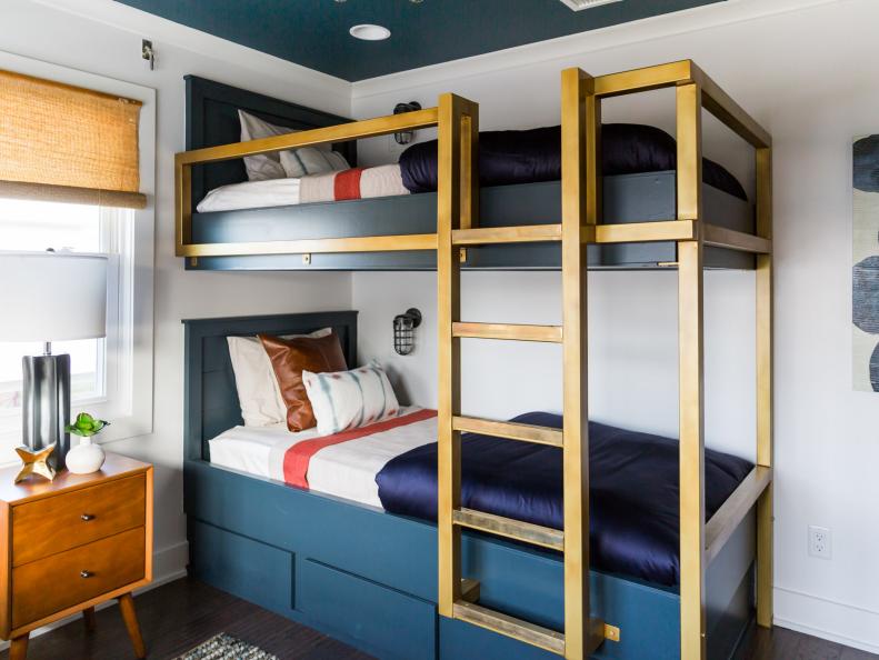 Bunk beds add functionality in a small guest bedroom designed by Jonathan Scott, as seen on Brother vs. Brother.