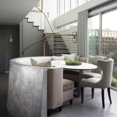 Dining Banquette Surrounded by Sculptural Zinc Wall