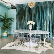 Clear Chairs Around Midcentury Modern Dining Table