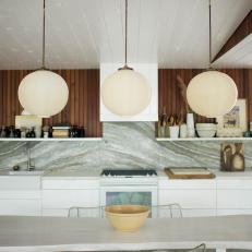 Pendant Lights Create Distinction Between the Kitchen and Dining Areas