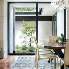 Contemporary Dining Room With Glass Wall