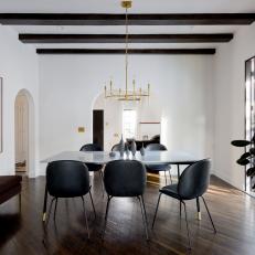 Mediterranean Dining Room With Black Chairs