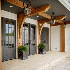 Stone Patio With Covered Area and Exposed Wooden Beams