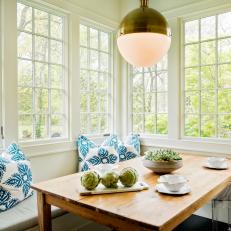 Sunroom With Banquette, Dining Table and Ample Natural Light
