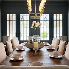 Gray Dining Room With Rustic Table and Candelabra Chandelier