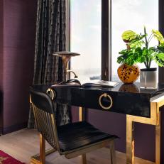 Desk in Purple Bedroom With City View