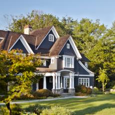 Copper Roofing and Gray Shingles on Tudor-Style Home
