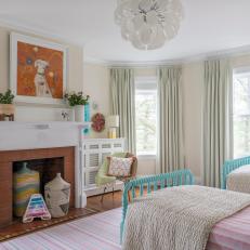 Multicolored Girls' Bedroom With Brick Fireplace