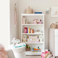 Tall Bookshelf Adds Storage and Display Space in This Girls' Nursery