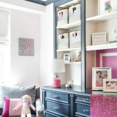 Blue Built In Shelving Unit and Desk With Raspberry Accents, Linen Basket Storage and Monogram Details  