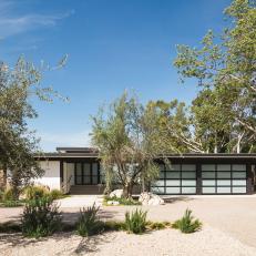 Midcentury Home Exterior With Opaque Glass