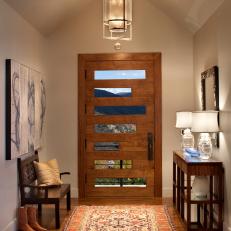 High Pitched Ceiling and Midcentury Modern Door in Home's Entryway