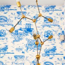 Blue Toile Wallpaper and Brass Light