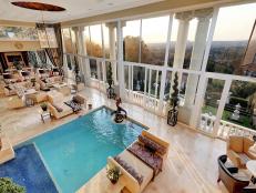 Indoor Pool With High Ceiling and Multiple Sitting Areas