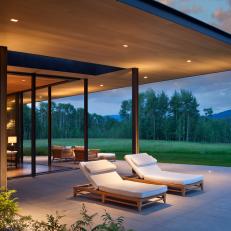 Patio With Chaises and Meadow View