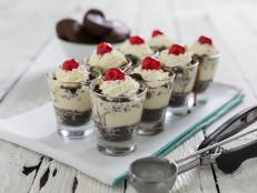 These brownie sundaes are just a few bites of decadence that your guests are sure to appreciate. Make them ahead and put them in the freezer, and then just top with whipped cream and a cherry to serve.