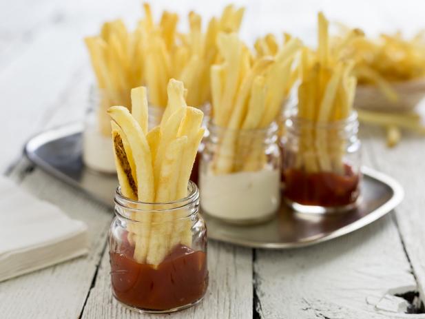 Fries Sitting in Shot Glasses of Ketchup