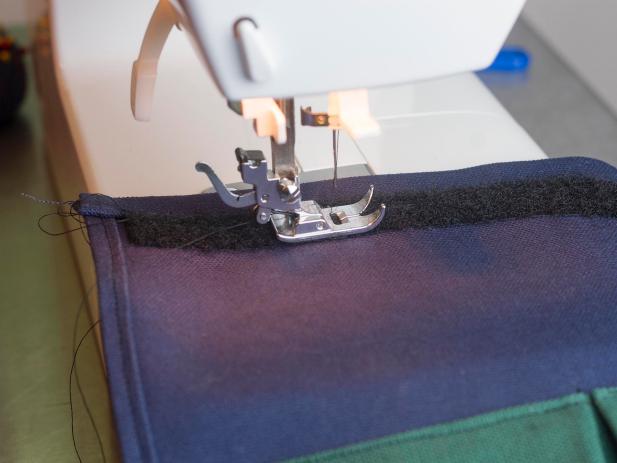 Add soft side of hook and loop tape to the bottom of the base fabric, just above the bottom fold by sewing it in place.