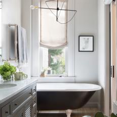 Gray Bathroom With Black Tub