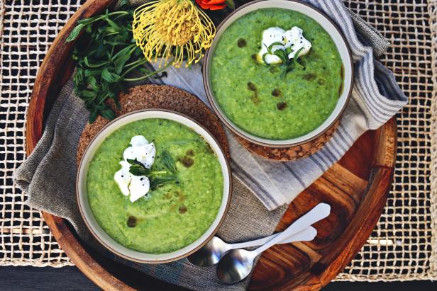 Blazing summer afternoons call for chilled relief! There’s nothing more refreshing than a cold soup to kick off your celebration - be it a patio party or just happy hour for two at home. This particular summer soup is decadent and creamy thanks to the addition of avocados, but is also vibrant and bright with mixed soft herbs and green peppers. Definitely don’t leave out the tarragon on this recipe, it’s unique bittersweet flavor has an aroma similar to anise that adds a bit of unexpected pop when combined with the other soft herbs. Velvety, savory and yet incredibly healthy, this avocado veggie power-packed soup would make for a stunning appetizer or meal alike! 
