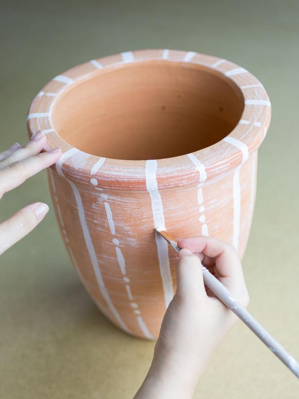 HGTV shows you how to make your own patterned terra cotta pots and a tile table