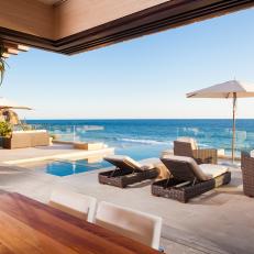 Beach House Patio With Lounge Chairs and Swimming Pool