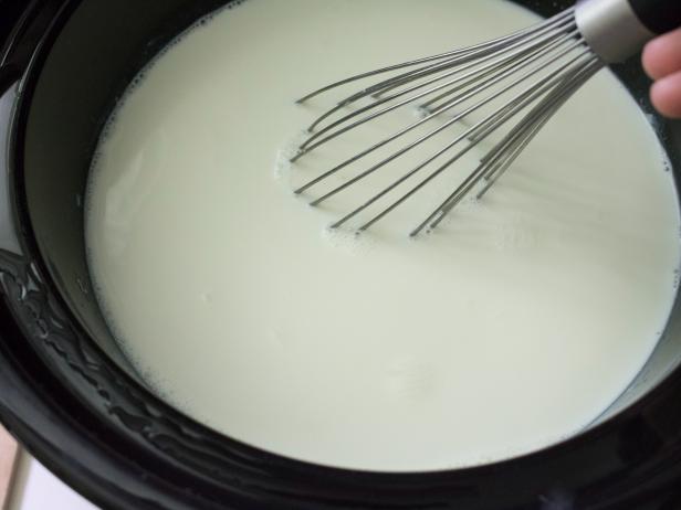 Wisk hot milk to mix in live cultures.