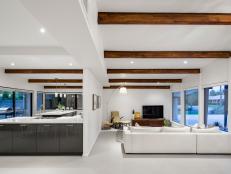 Exposed Beams Create Design Continuity Throughout Contemporary Home