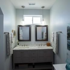 Contemporary Blue Double Vanity Bathroom with a High Window 