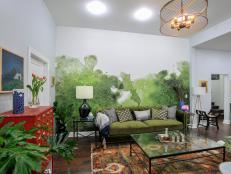 Green Living Room with Green Velvet Sofa and Abstract Accent Wall