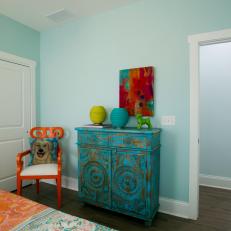 Contemporary Blue Bedroom with Orange Chair