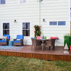 Contemporary Backyard with Brown Deck and Wicker Furniture 