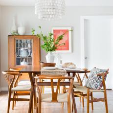 Midcentury Modern Dining Room With Tiered Chandelier