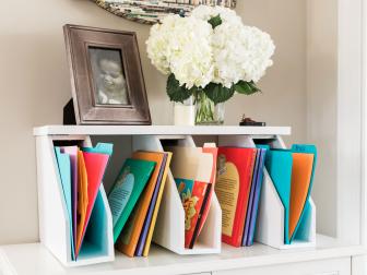 If your family has trouble wrangling homework and other important papers, then this easy DIY may be just what you need. Spruce up an old shelf or board with a fresh coat of paint, then spray a few magazine organizers to match. Secure the board atop the organizers using screws or a heavy-duty adhesive and voila! Instant homework station. Try color coding files for each child. HINT: If you hang on the wall make sure it’s properly anchored to support the weight!