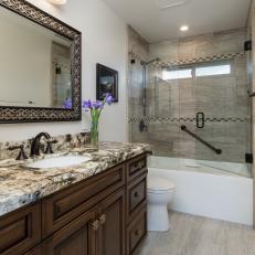 Small Bathroom With Granite Countertop and Glass Shower