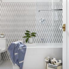 White Art Deco Bath With Penny Tile and Patterned Wallpaper